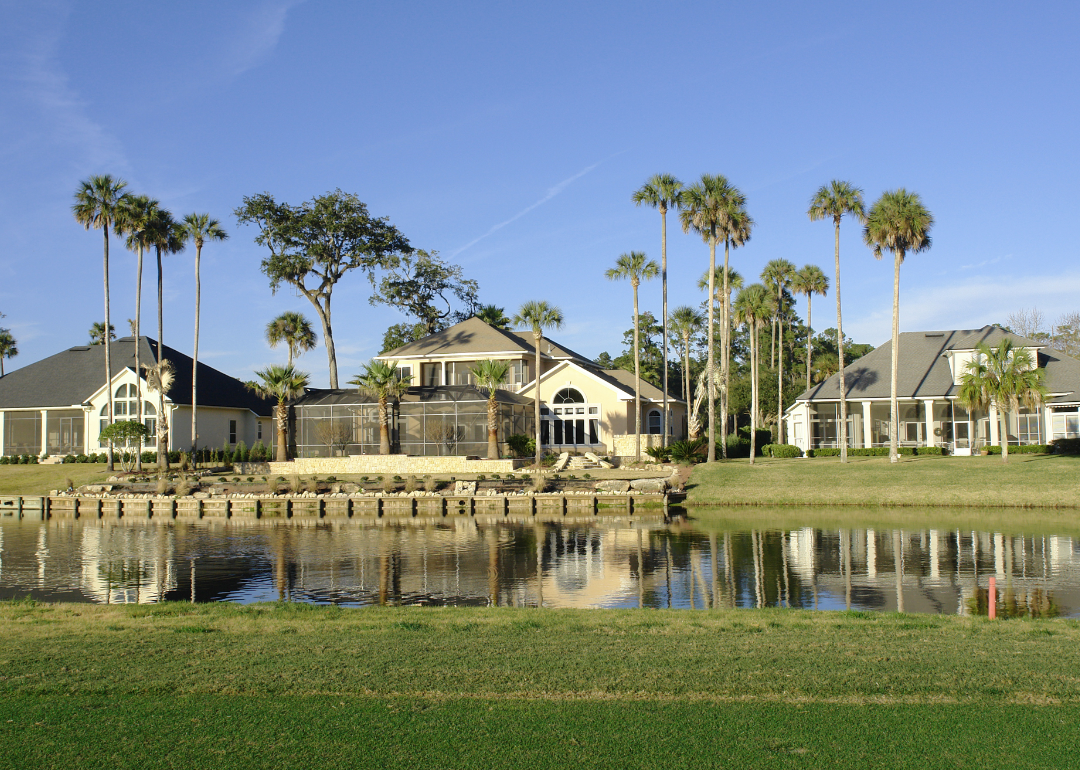 Three Florida houses on the dge of a golf course.