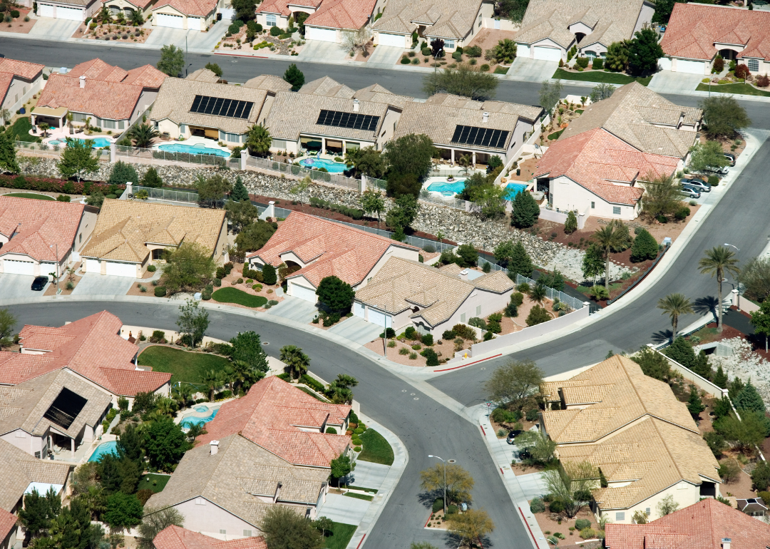 An aerial view of homes with pools.