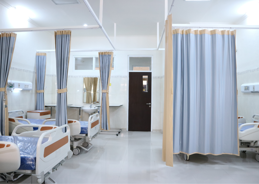 A row of empty hospital beds