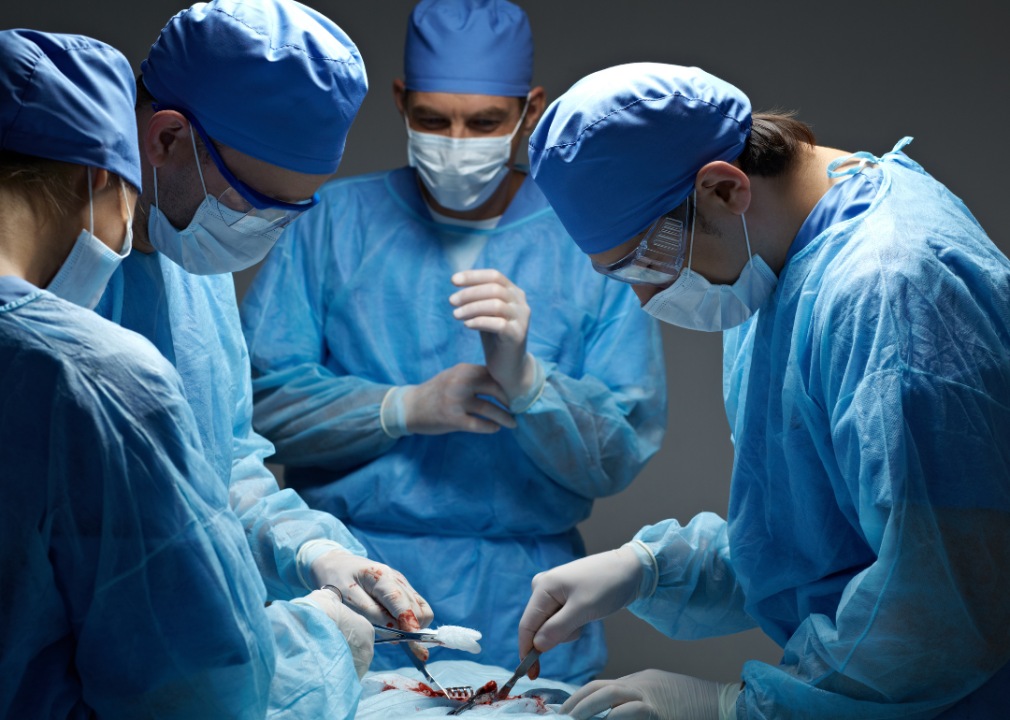 A closeup of surgeons in an operating room performing a surgery.