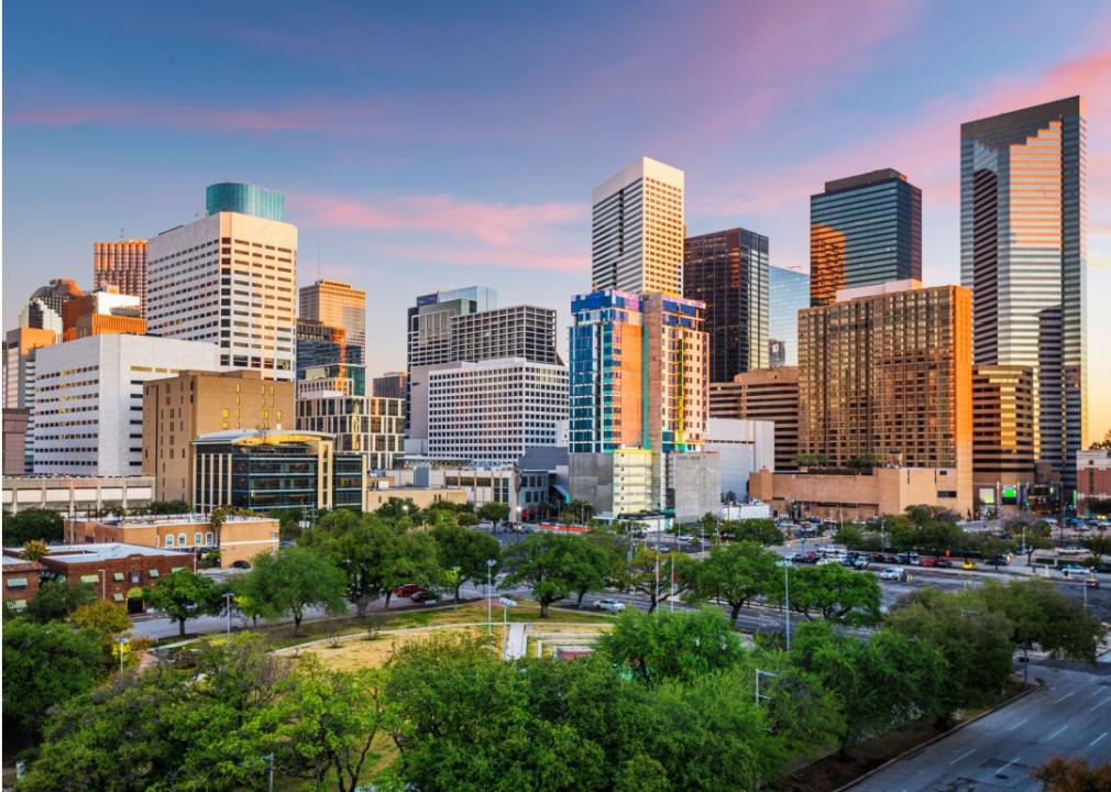 City skyline is dominated by a cluster of tall skyscrapers in the center, with a mix of shorter buildings and structures spreading out towards the edges of the image.