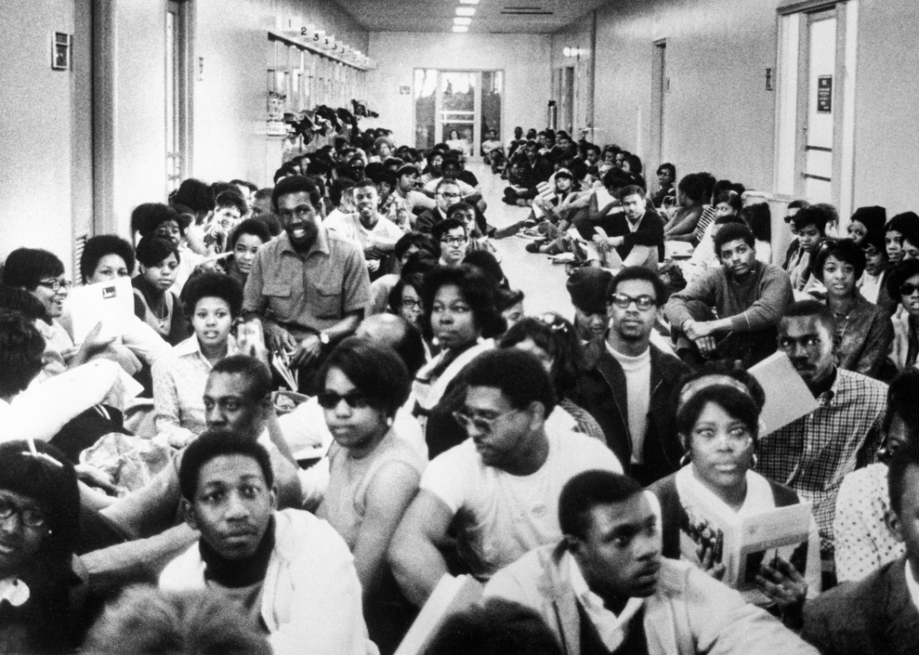 Students seated in a hallway at Howard University.