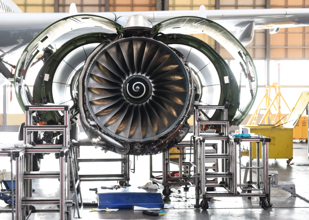 An aircraft engine in a hangar.