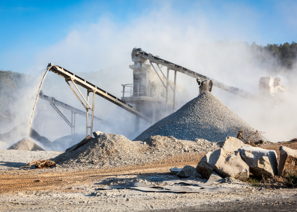 Machines moving stone at a quarry.