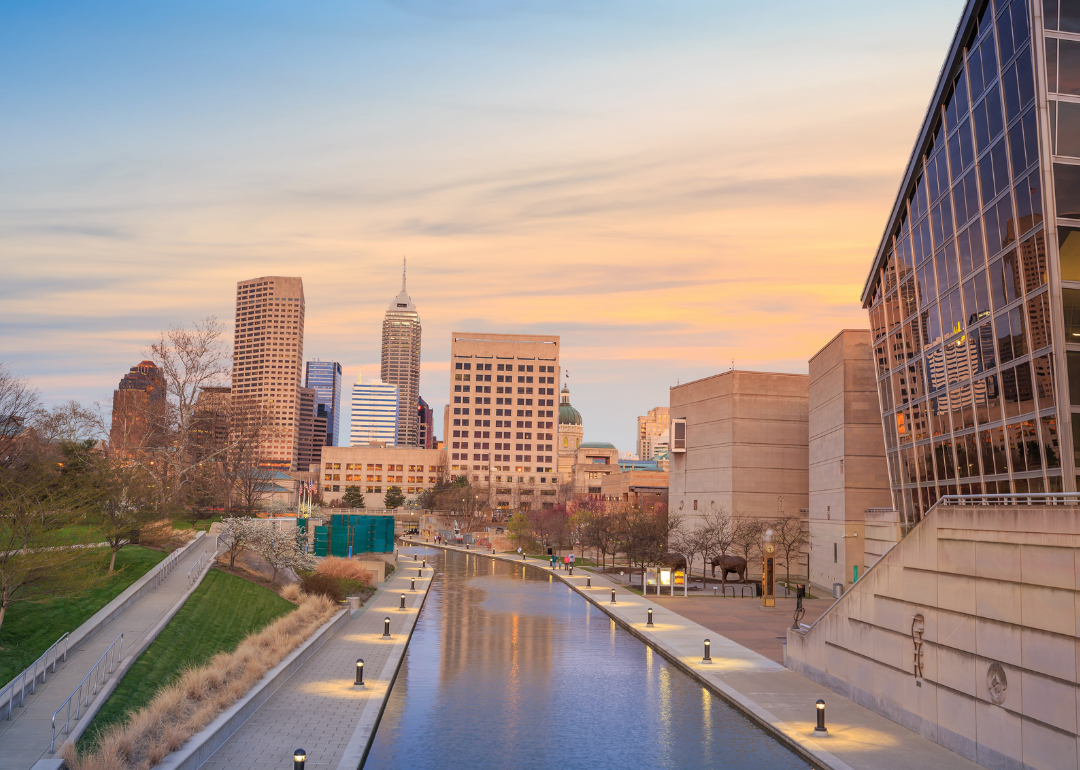 An Indianapolis riverwalk with buildings in the background. 