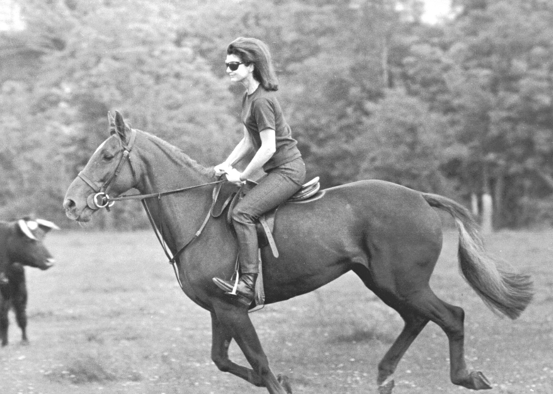 Jackie Kennedy riding on horseback near the time of her engagement