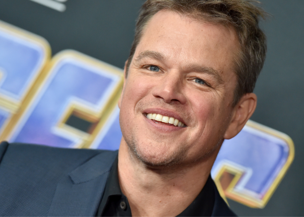 Matt Damon smiles at event.