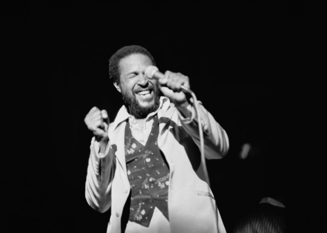 Marvin Gaye performing on stage.