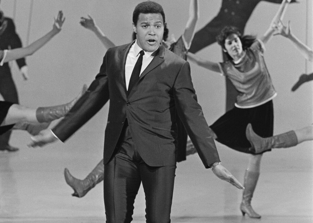 Chubby Checker performing ‘The Twist’ with dancers.