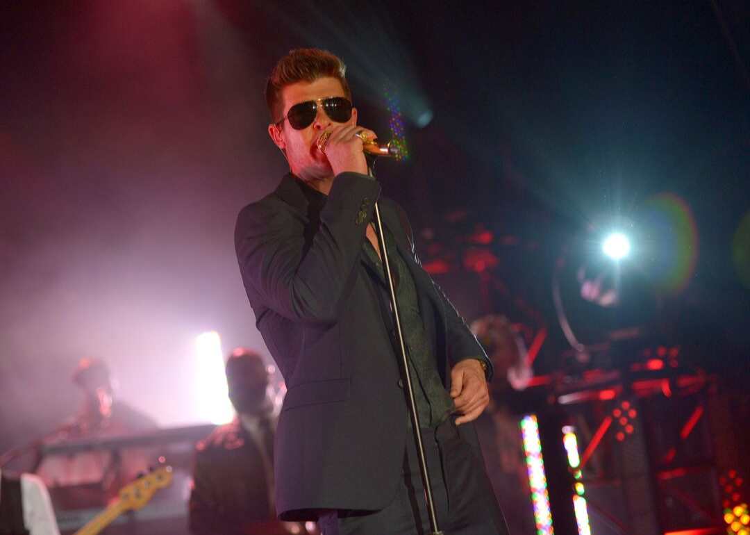 Robin Thicke performing onstage.