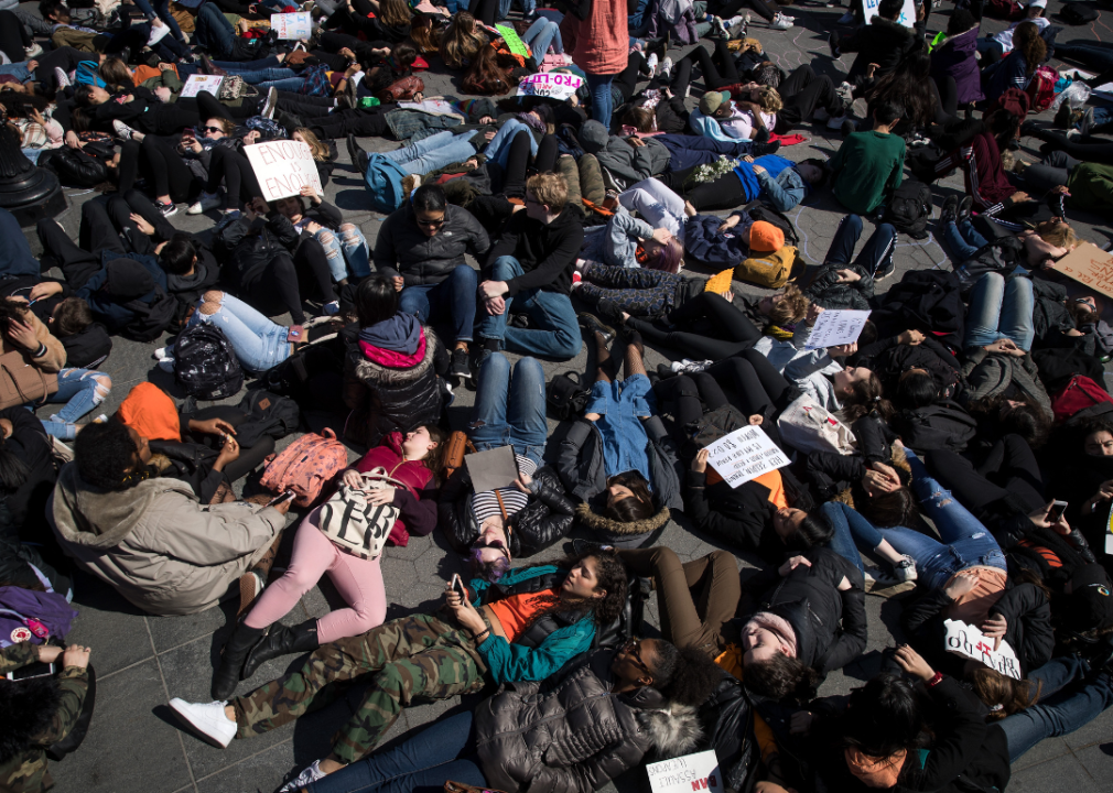 Students lie on the ground in Washington Square Park.