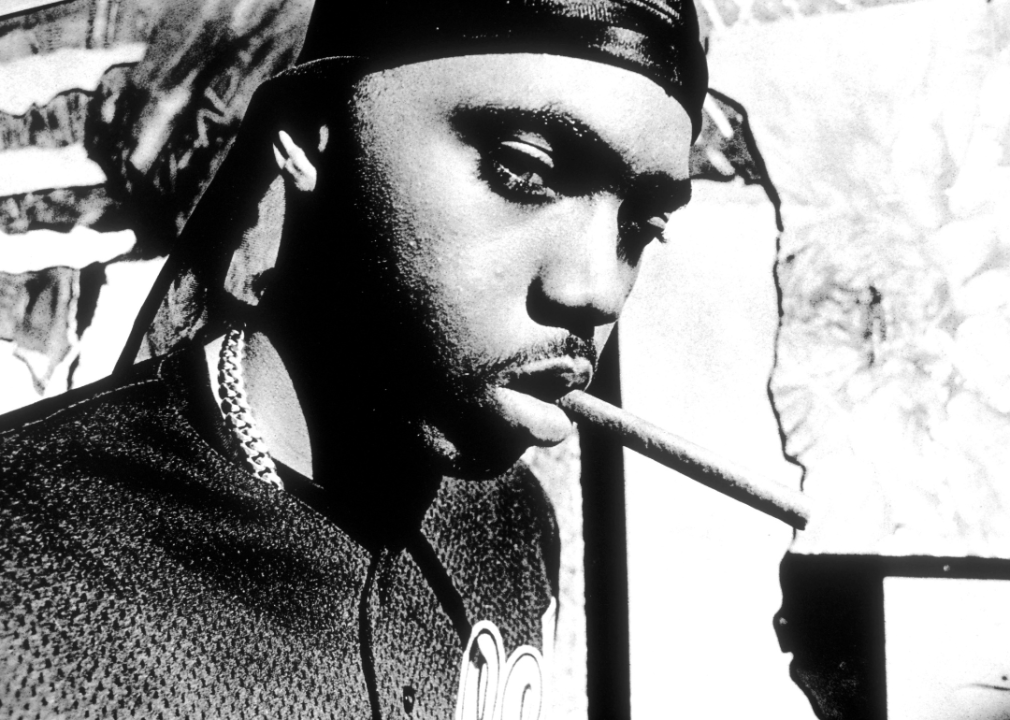 Shizzle Nas with a cigar in his mouth.