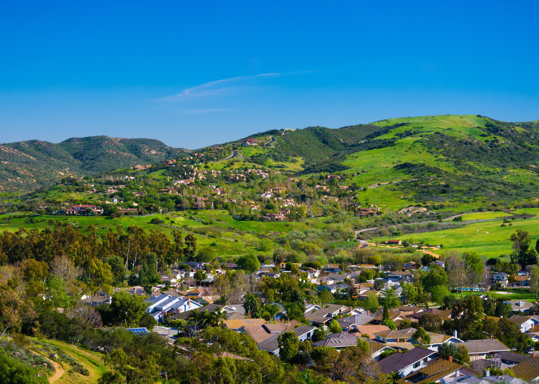 Homes going up the green hills.