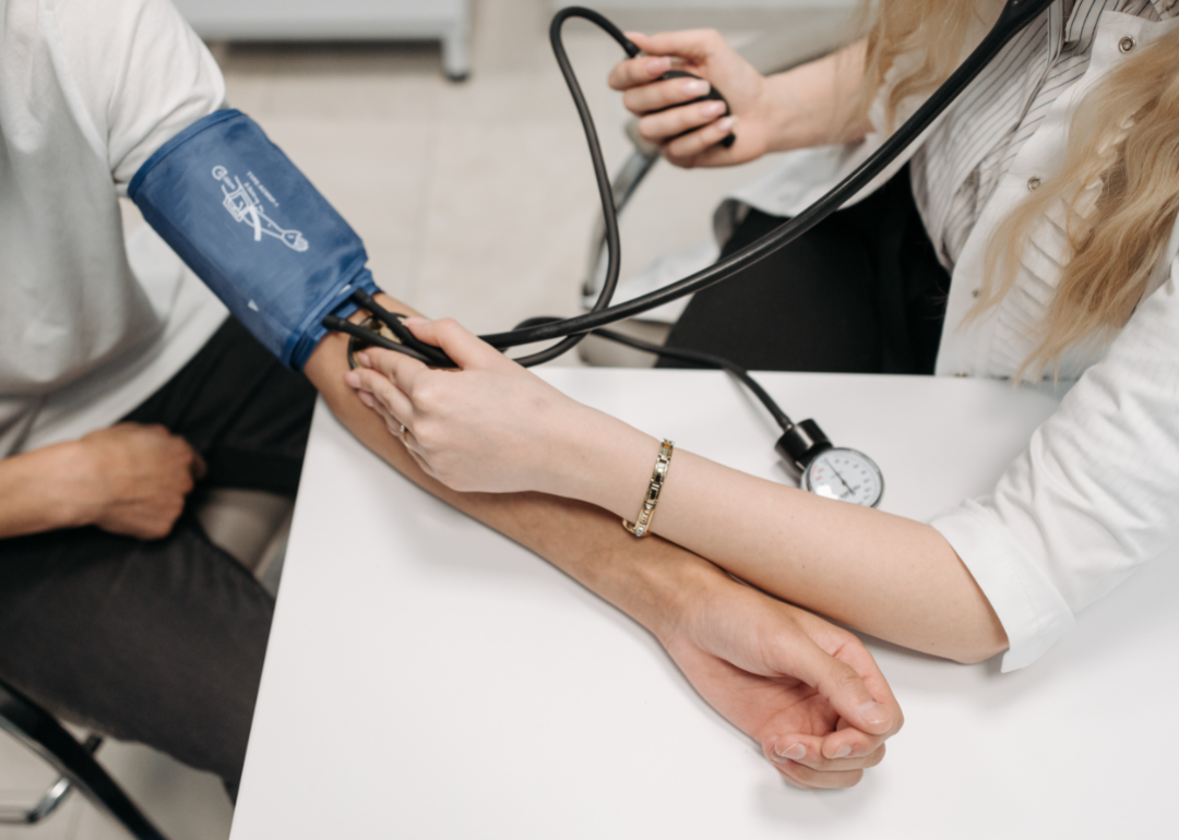 A physician checks a patients blood pressure