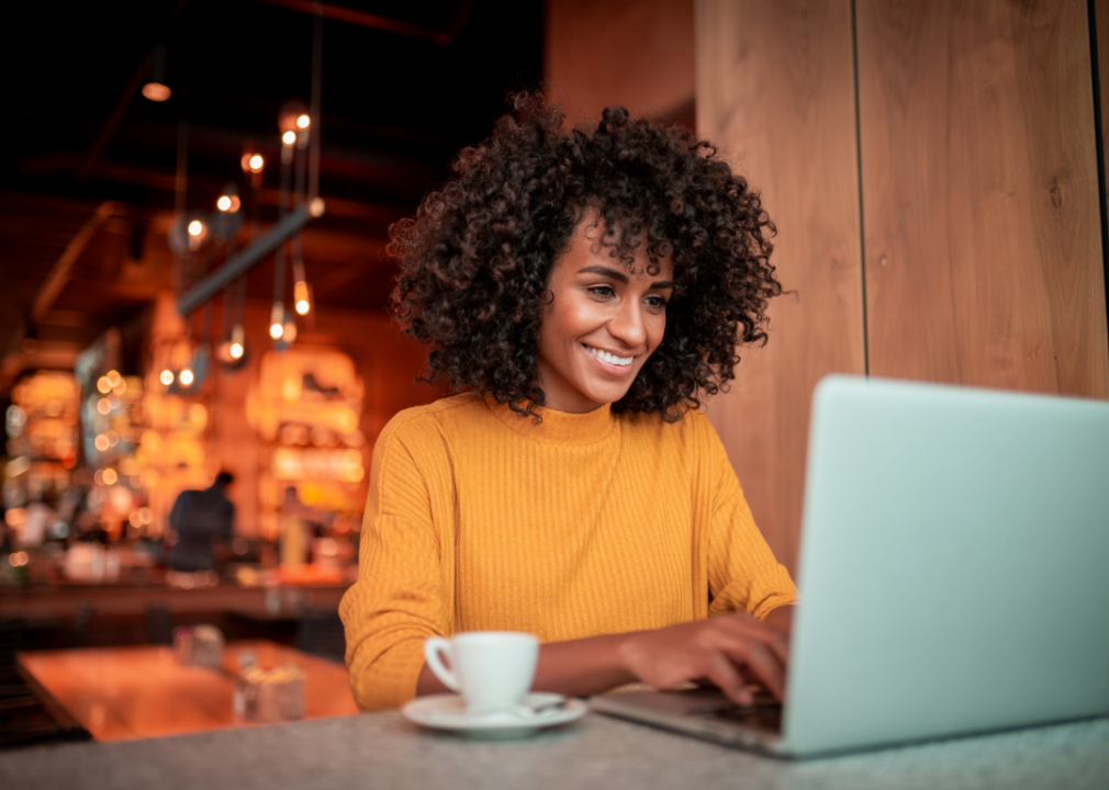 These are the 13 states with comprehensive consumer privacy protection laws A woman using a laptop in a cafe.