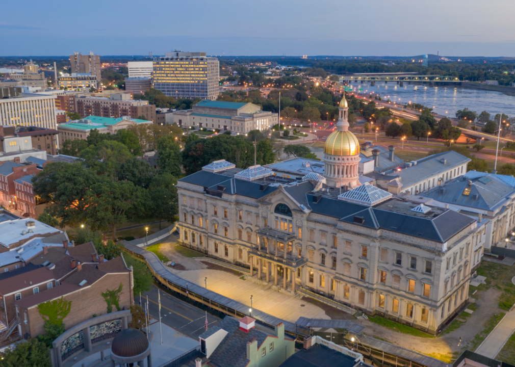 An aerial view of the capitol building in Trenton with the Delaware River in the background.
