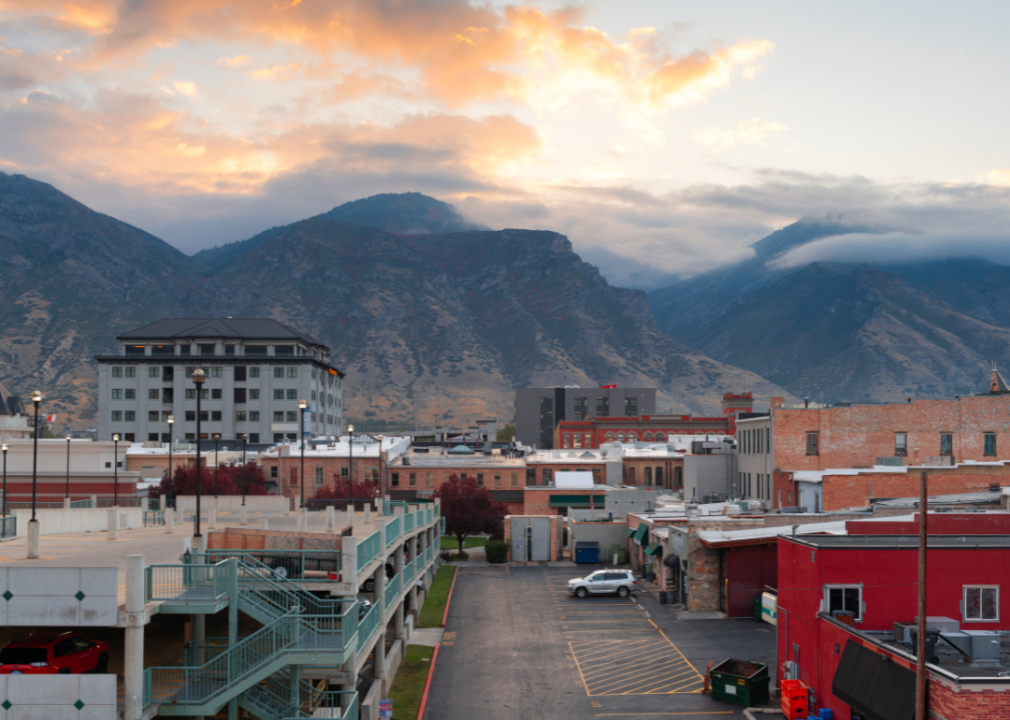 Aerial view of the city buildings with mountains in the background.