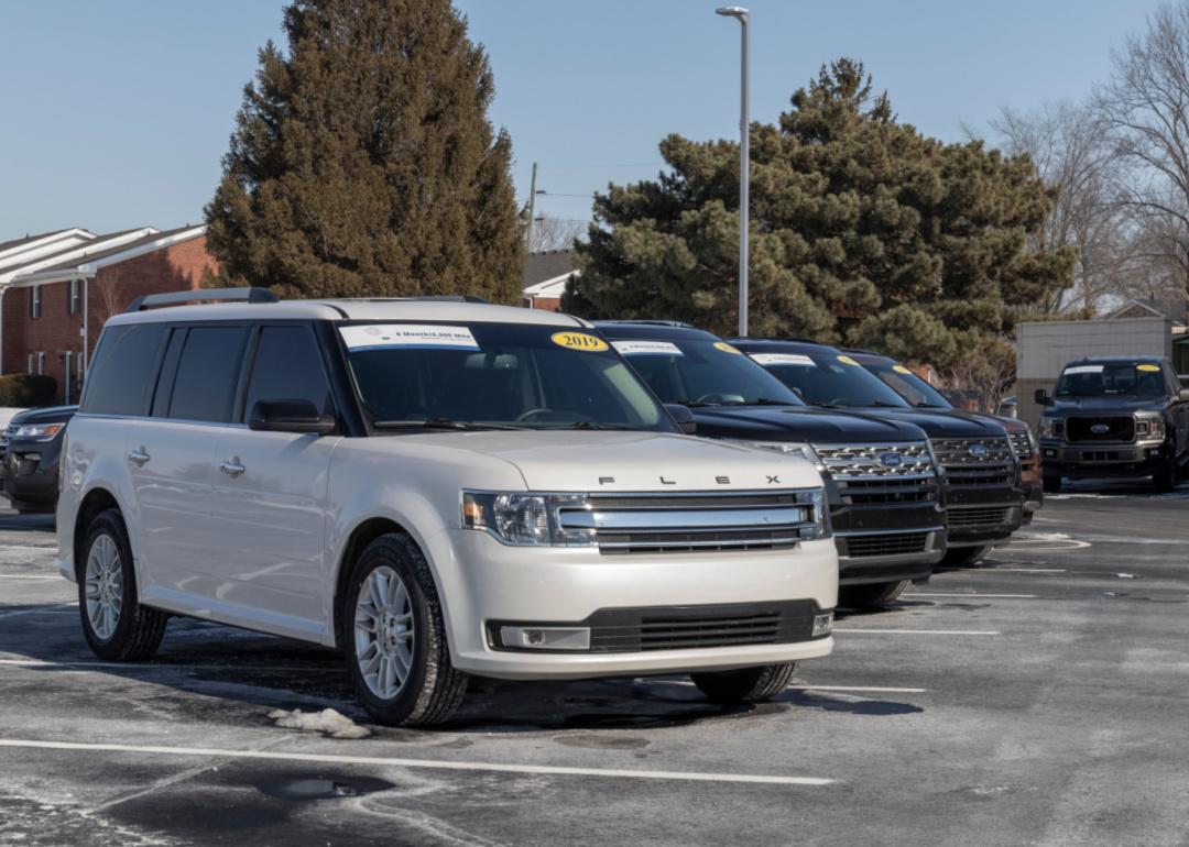 A white Ford Flex in a parking lot.