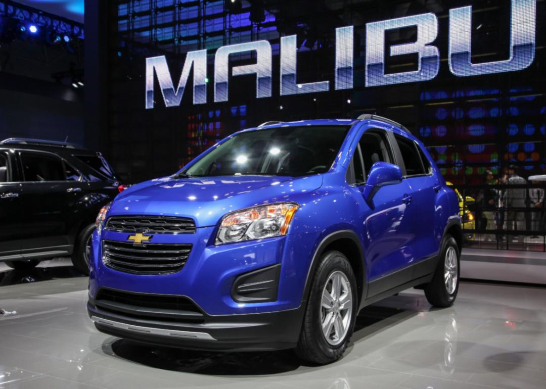 A blue Chevrolet Trax in a showroom.