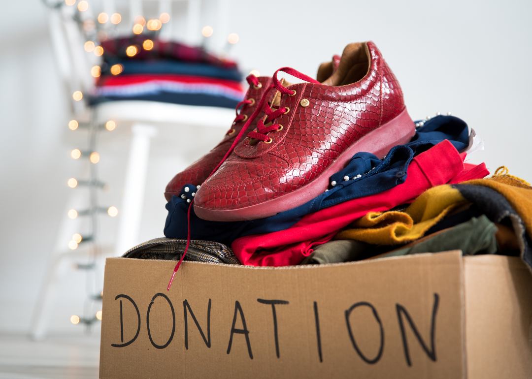 A donation box of unwanted clothing and shoes.
