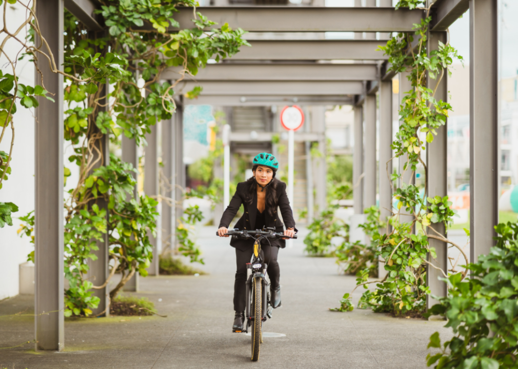 A woman riding an e-bike to work.