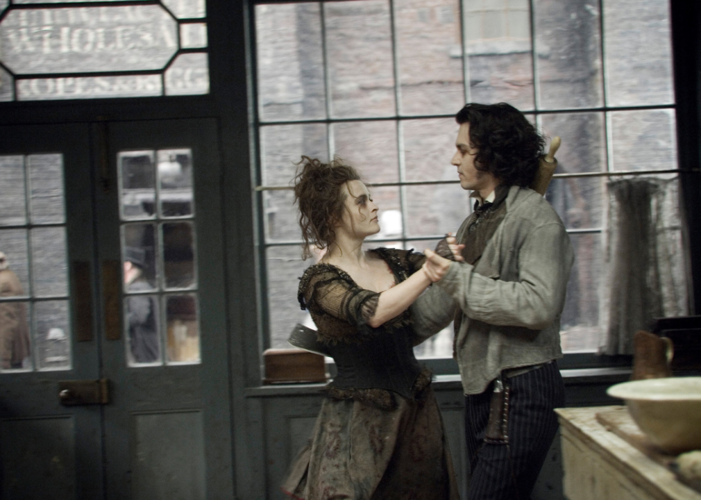 Johnny Depp and Helena Bonham Carter dancing in costume.