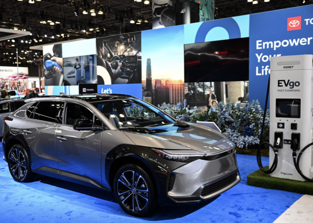 A silver Toyota SUV electric vehicle in a showroom.