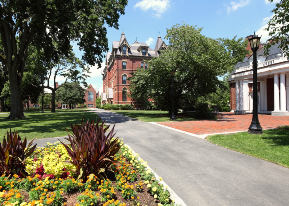 Exterior view of a driveway leading into the campus of Tufts University.