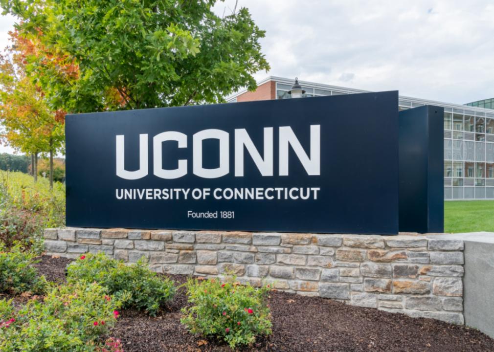 A brick sign with UCONN university lettering.