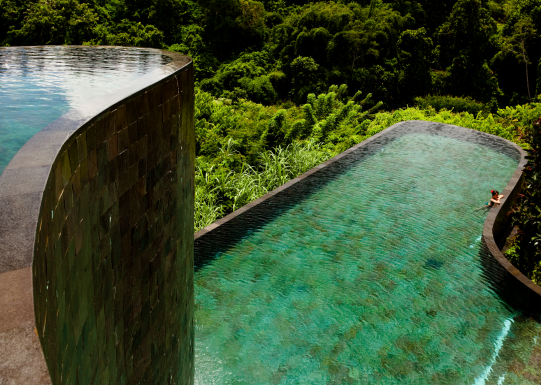 Two levels of pools surrounded by jungle in the Ubud Hanging Gardens Hotel and Spa in Bali.