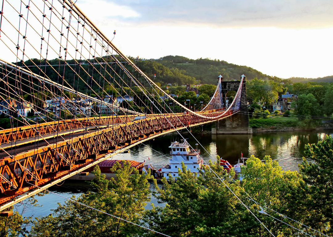 A barge going under the famous suspension bridge in Wheeling, West Virginia.