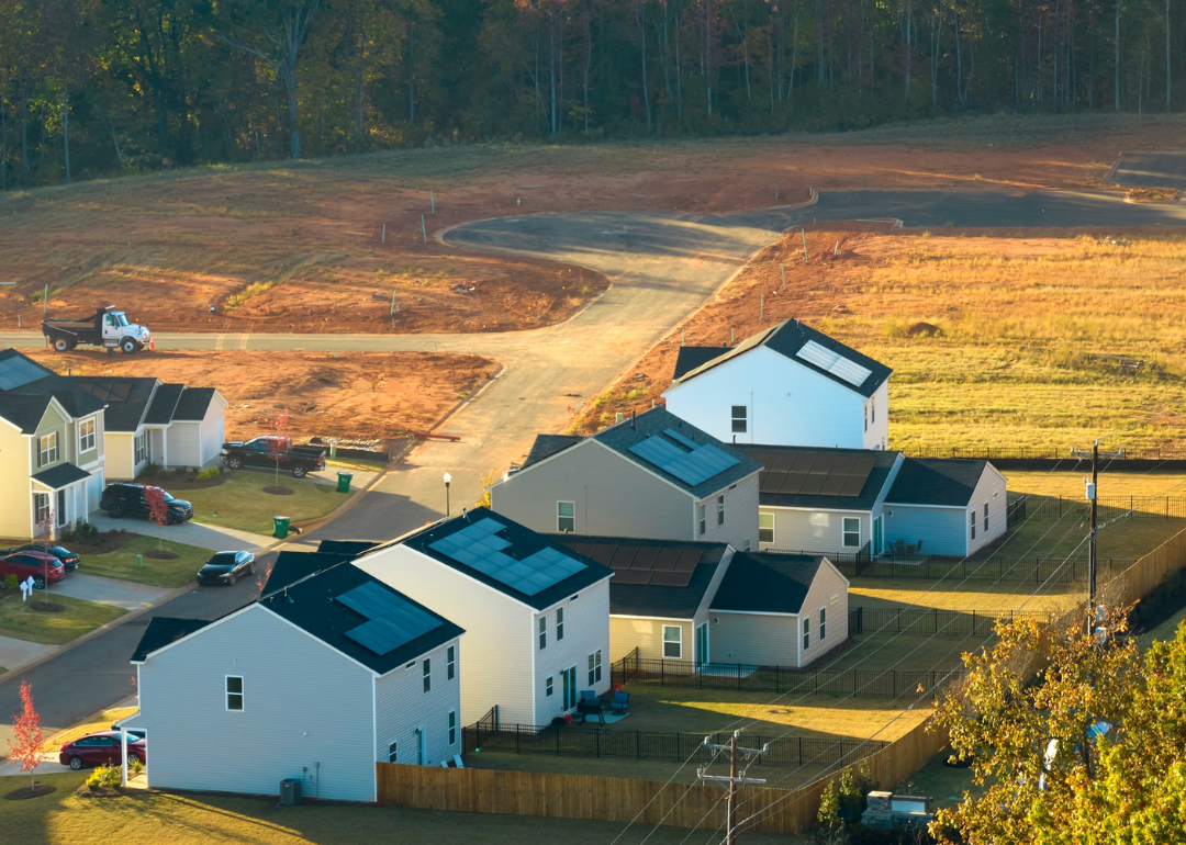 An aerial view of a real estate development's construction site of new, tightly packed homes in South Carolina. 