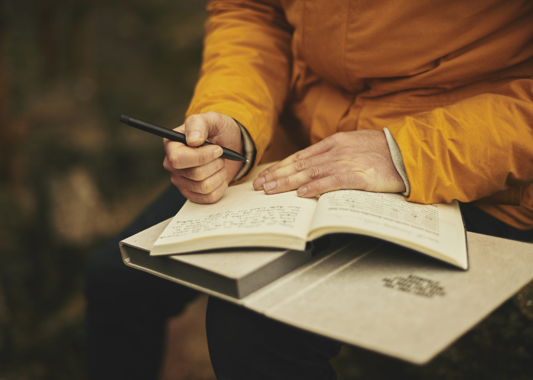 A person writing in their journal.