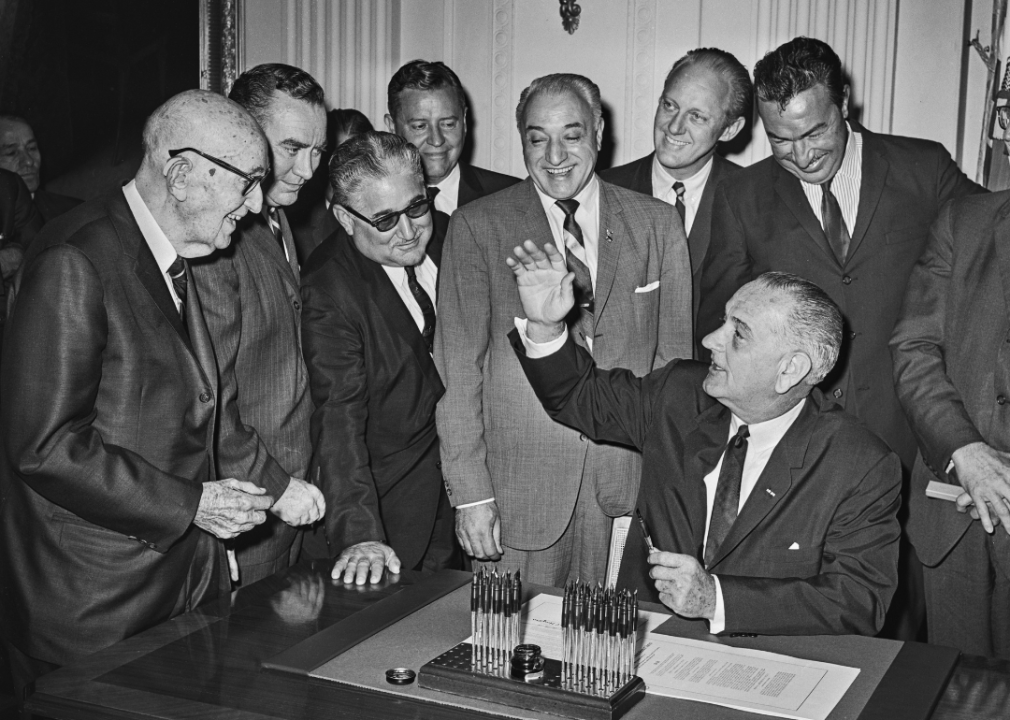US President Lyndon B. Johnson signing the National Defense Education Acth