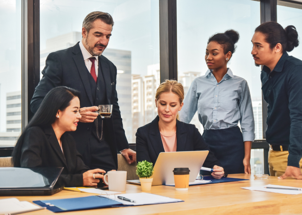 A marketing manager and his team meeting together