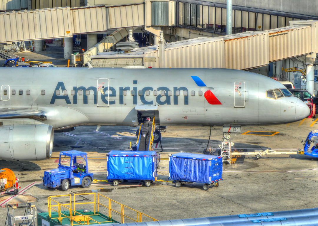 Baggage offloading of an American Airlines plane at Logan Airport Boston.