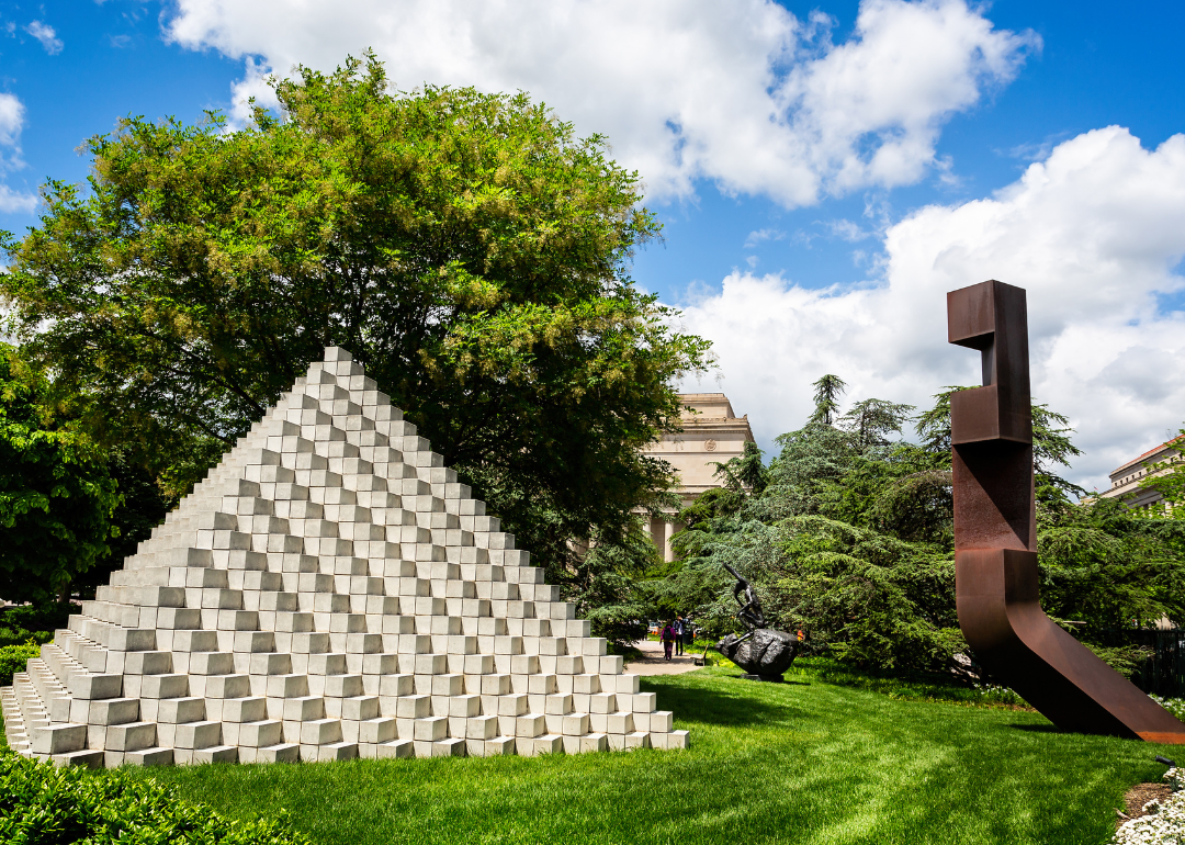 Sculpture titled Four-Sided Pyramid by Sol LeWitt on display in the National Gallery of Art Sculpture Garden.