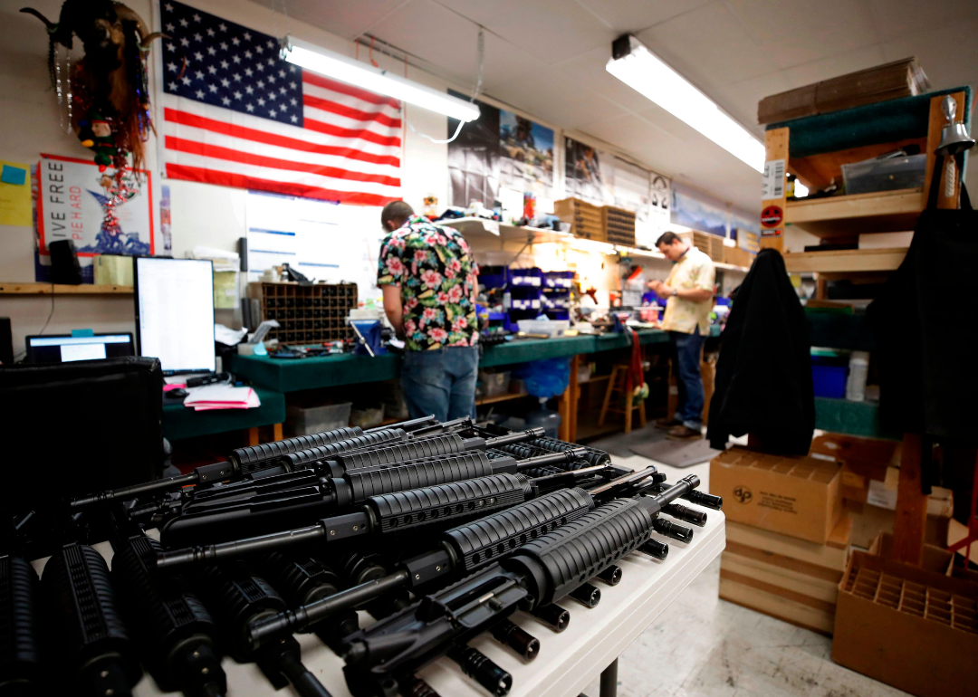 AR-15 style rifle barrels sit on a cart as workers assemble the guns at Davidson Defense in Orem.