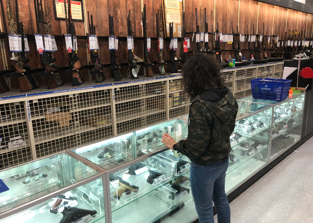 A person browsing guns in Louisiana.
