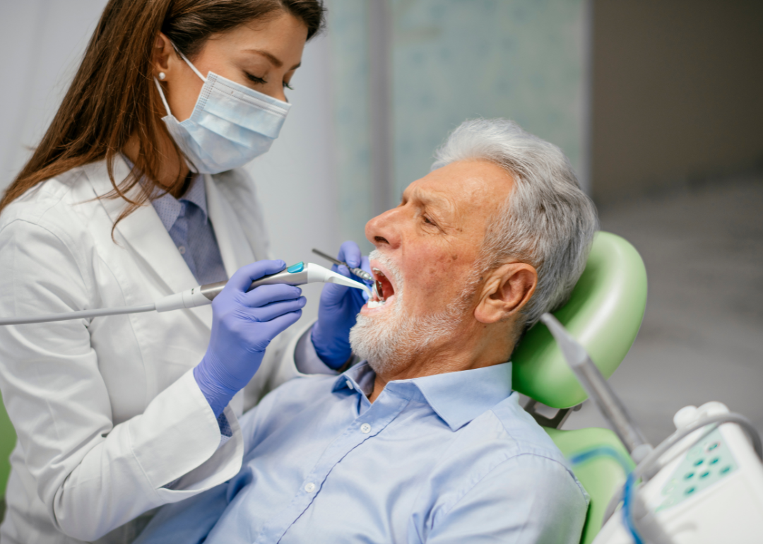 A patient in a chair getting dental work.