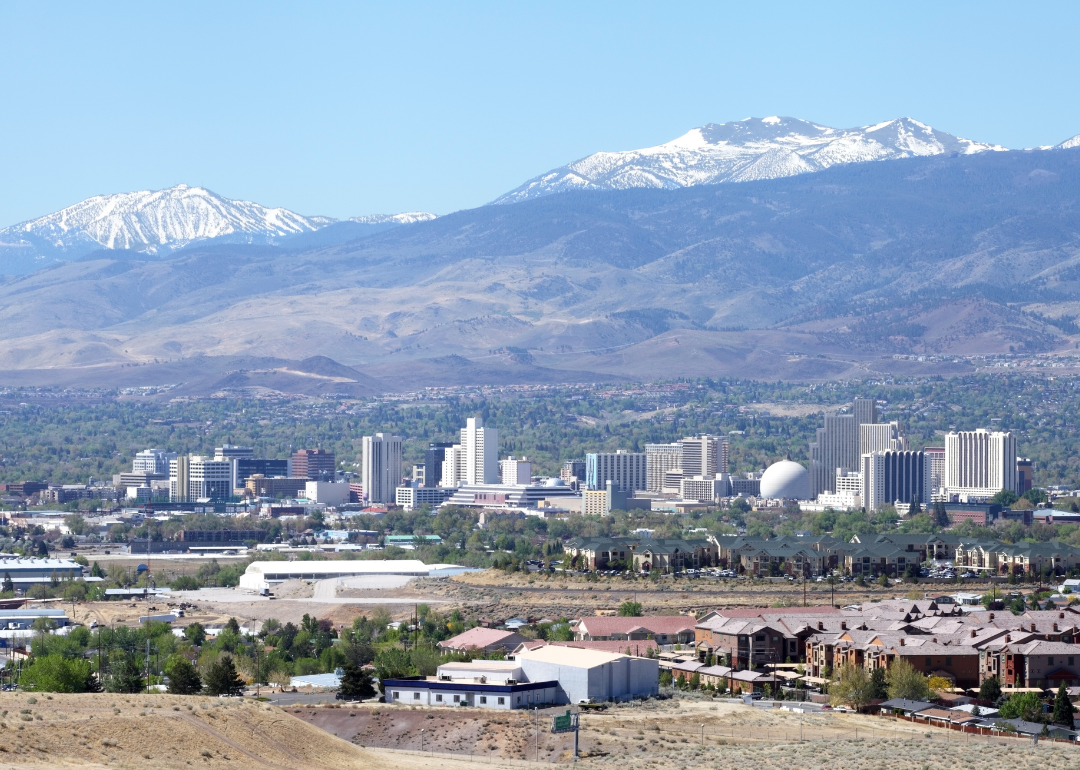 An aerial view of Reno with mountains in the background.
