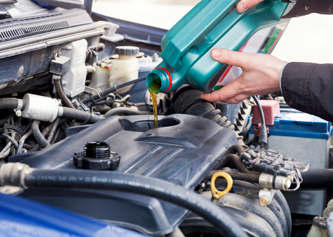 A car's motor receiving an oil change.