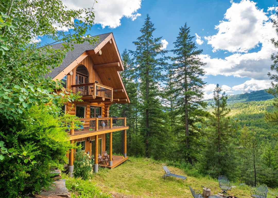 A three-story log home with decks in the mountains near Coeur d'Alene, Idaho.