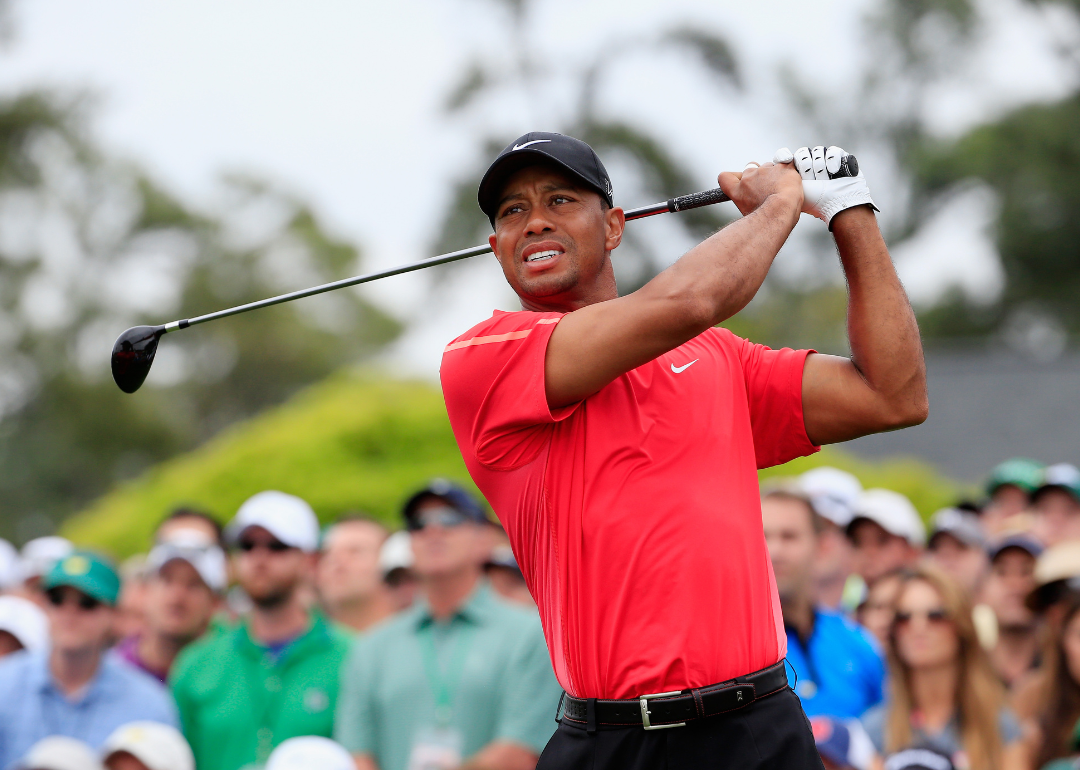 Tiger Woods watching his tee shot on the first hole during the final round of the 2015 Masters Tournament at Augusta National Golf Club on April 12, 2015.