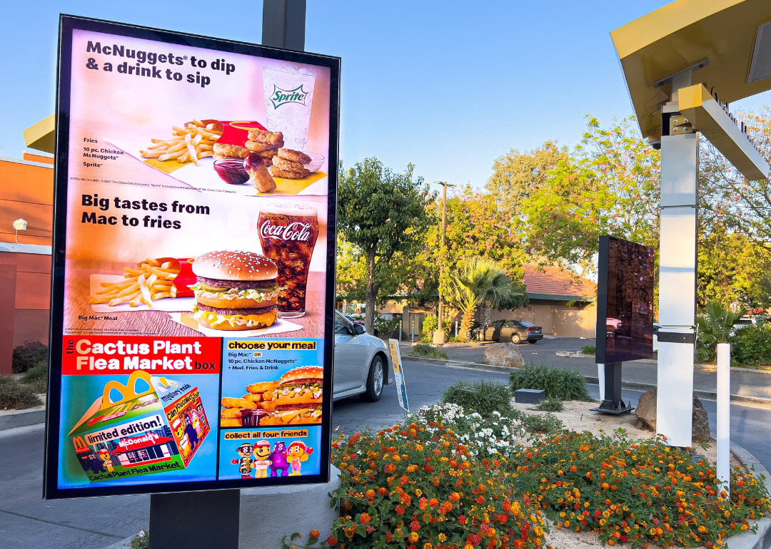 A screen showing the digital menu at the entrance of a McDonald's restaurant.