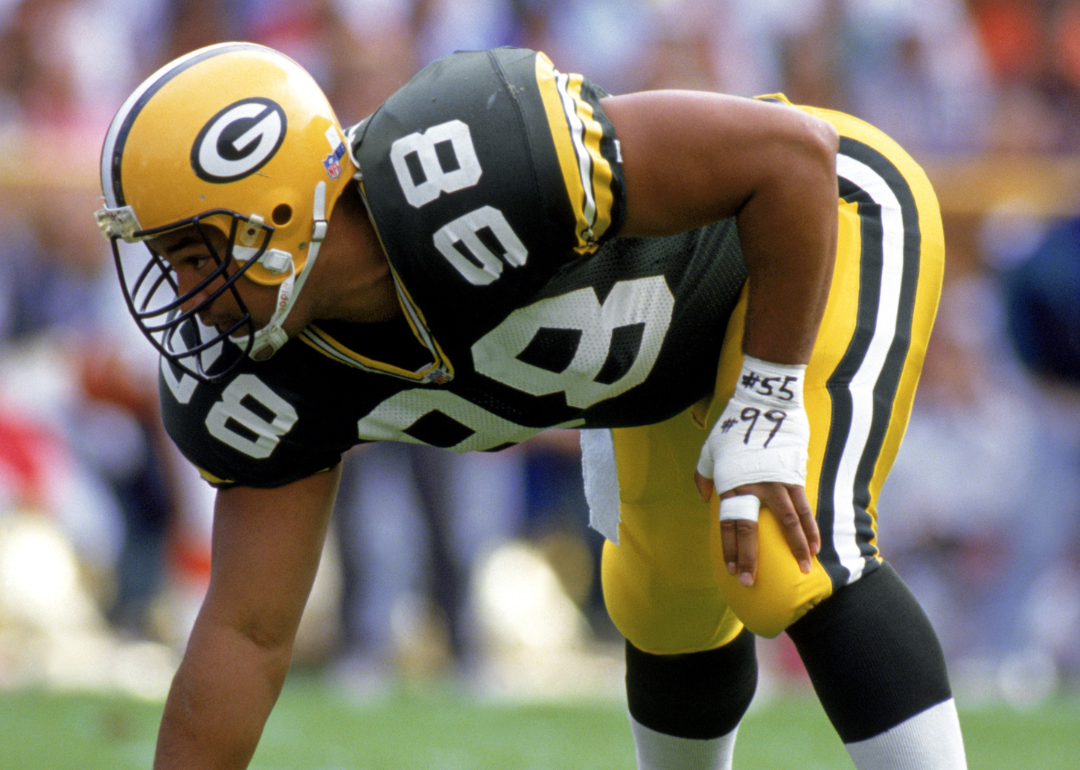 Defensive tackle Esera Tuaolo #98 of the Green Bay Packers preparing for the snap on September 20, 1992, during the NFL game against the Cincinnati Bengals.