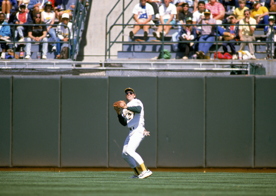 Outfielder Billy Bean, #27 of the Oakland Athletics, preparing to throw the ball during a game in the 1989 MLB season at Oakland-Alameda County Stadium.