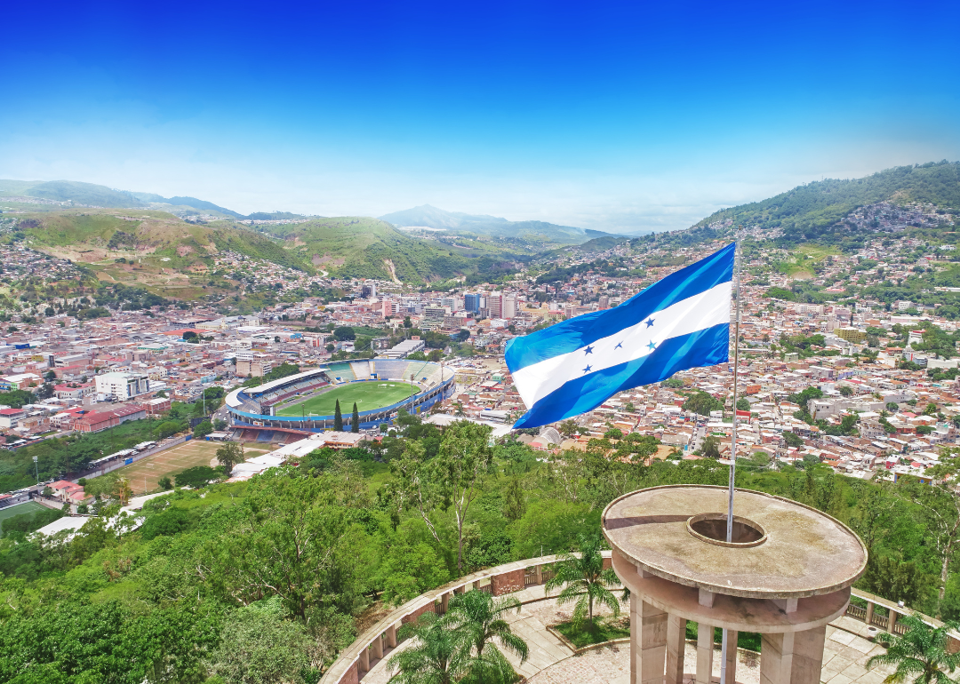 The flag of Honduras flying over Tegucigalpa
