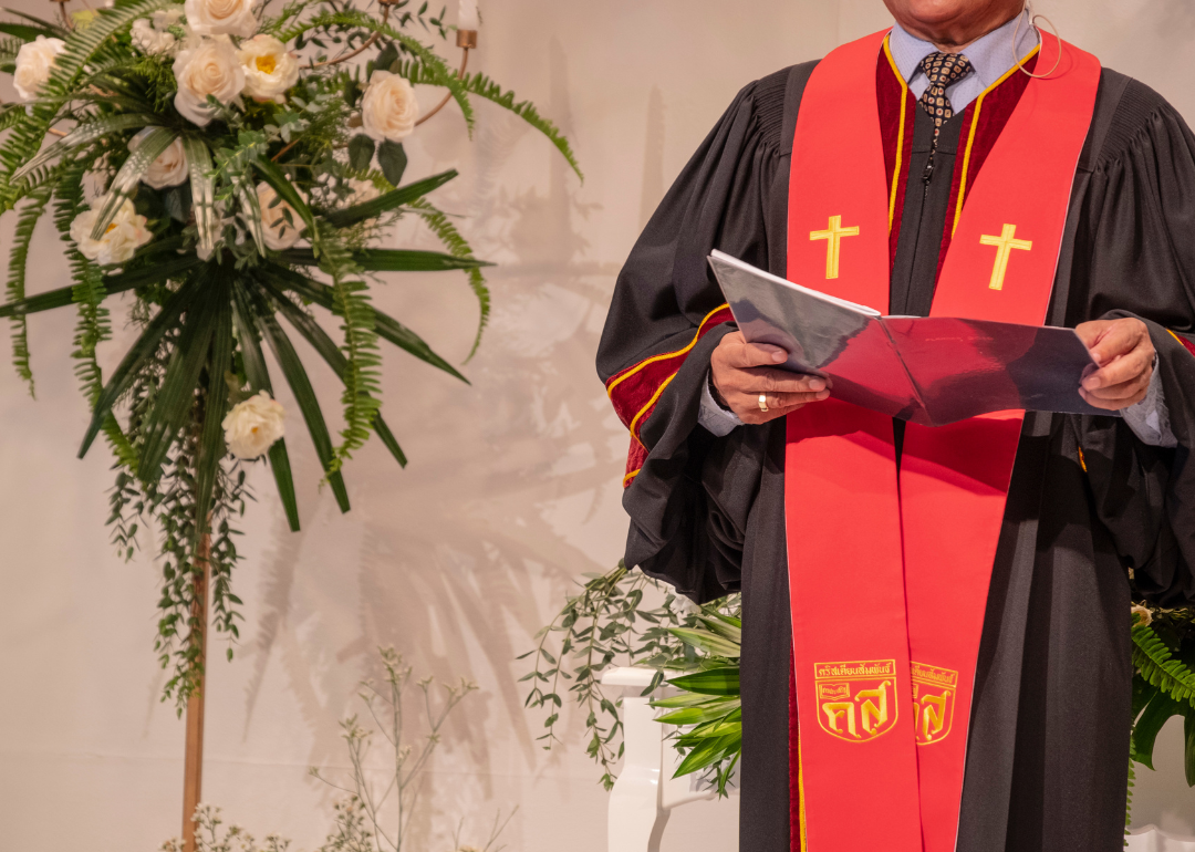 A minister giving a sermon during a religious service.