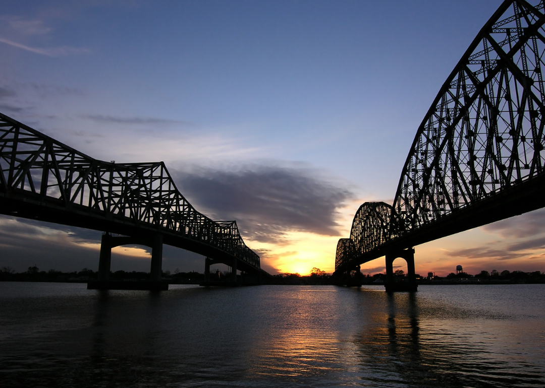 Two historic bridges in Morgan City at sunset.